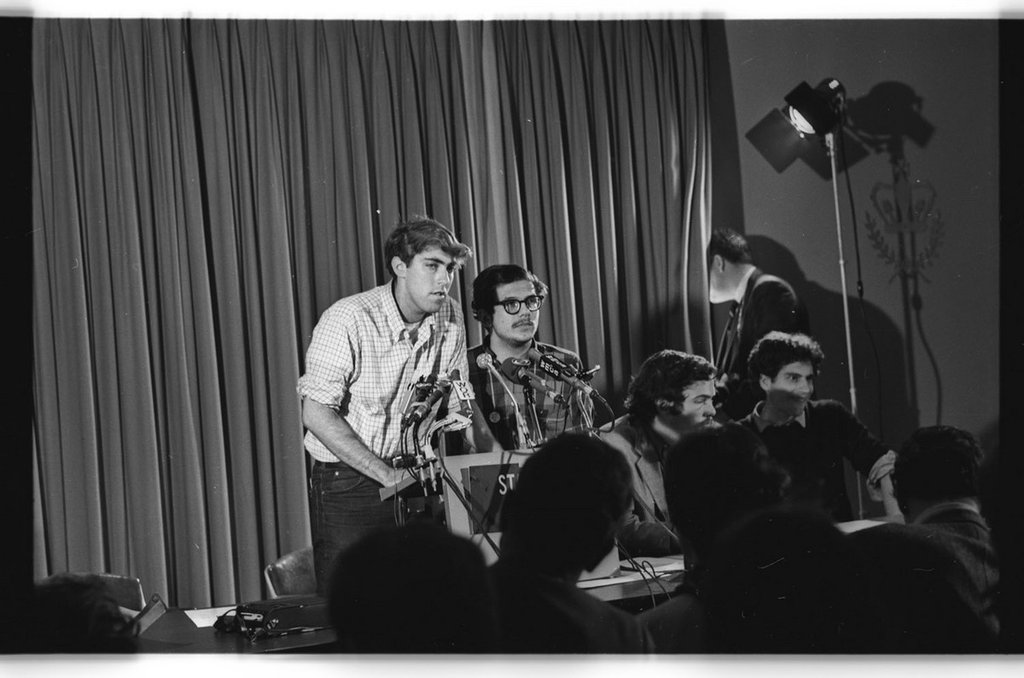 Image of Mark Rudd and other SDS leaders at a Strike Coordinating Committee Press conference